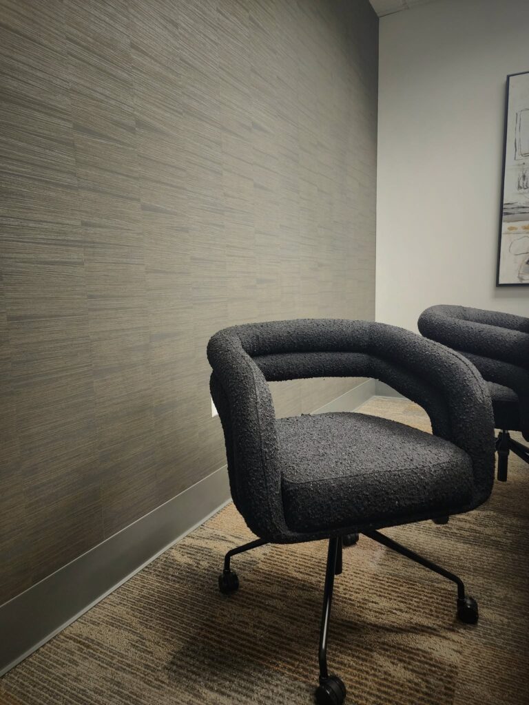 Conference room wall paper and chairs customized by Valia Design Build